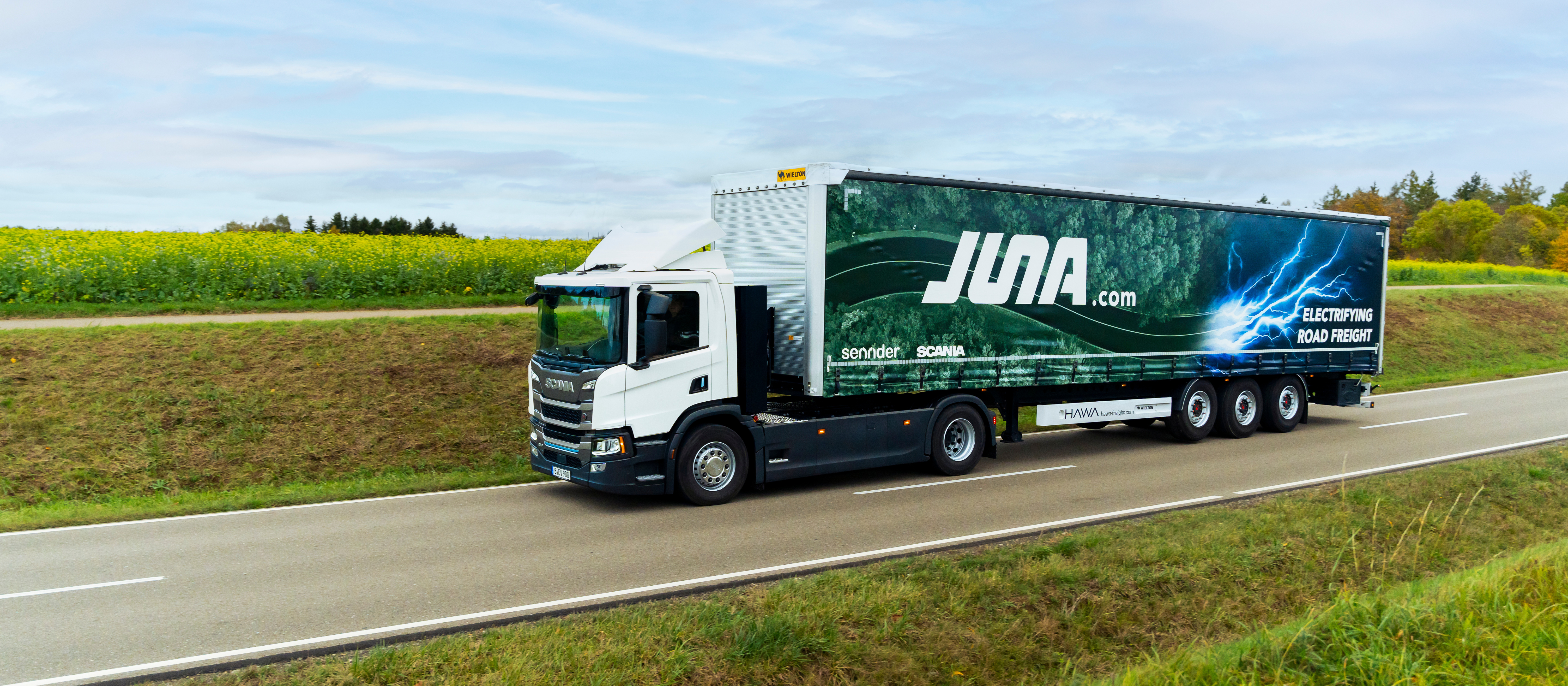 Read more about the article Scania i Sennder zakładają JUNA, spółkę joint venture mającą na celu wprowadzenie na dużą skalę elektrycznych ciężarówek i przyspieszenie dekarbonizacji europejskiej logistyki drogowej